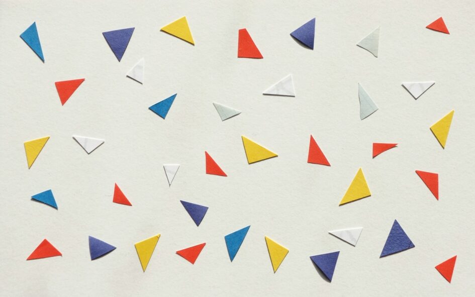 assorted-color paper pieces on white surface